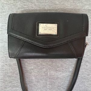 Tignanello black leather crossbody with removable strap and animal print inside